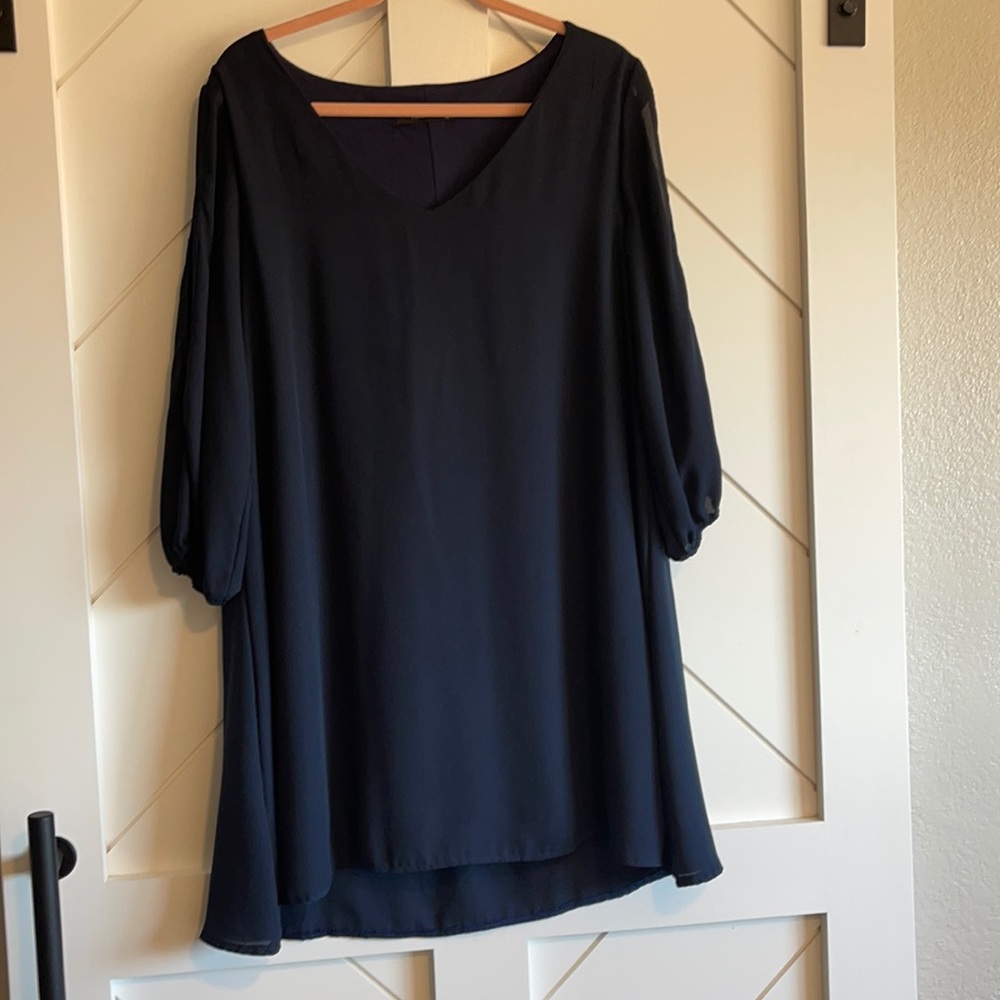 Navy blue cold should long sleeve dress.